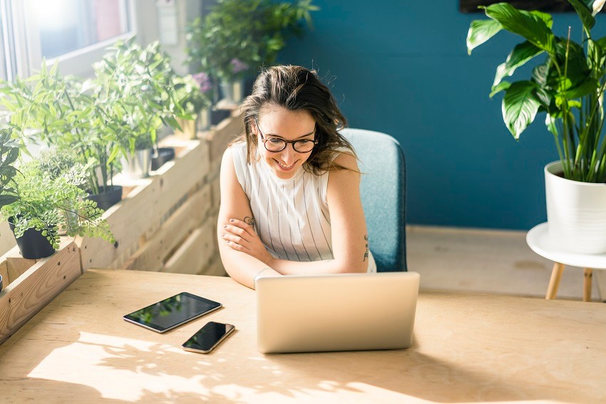 Woman sitting at a desk on a laptop